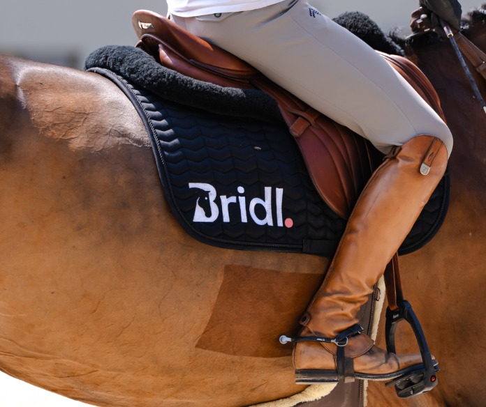 Premium equestrian leather saddle in warm golden light